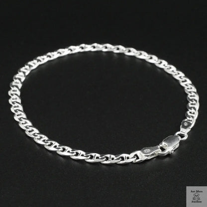 Silver chain bracelet on a black background