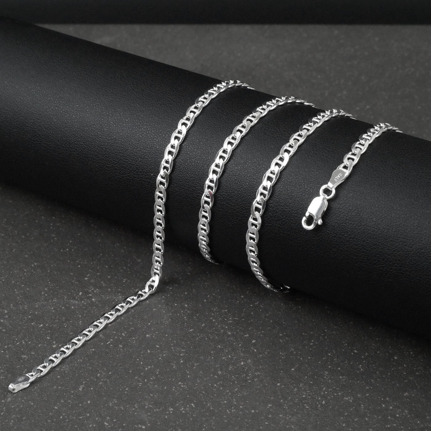 Silver marina chain on a dark surface