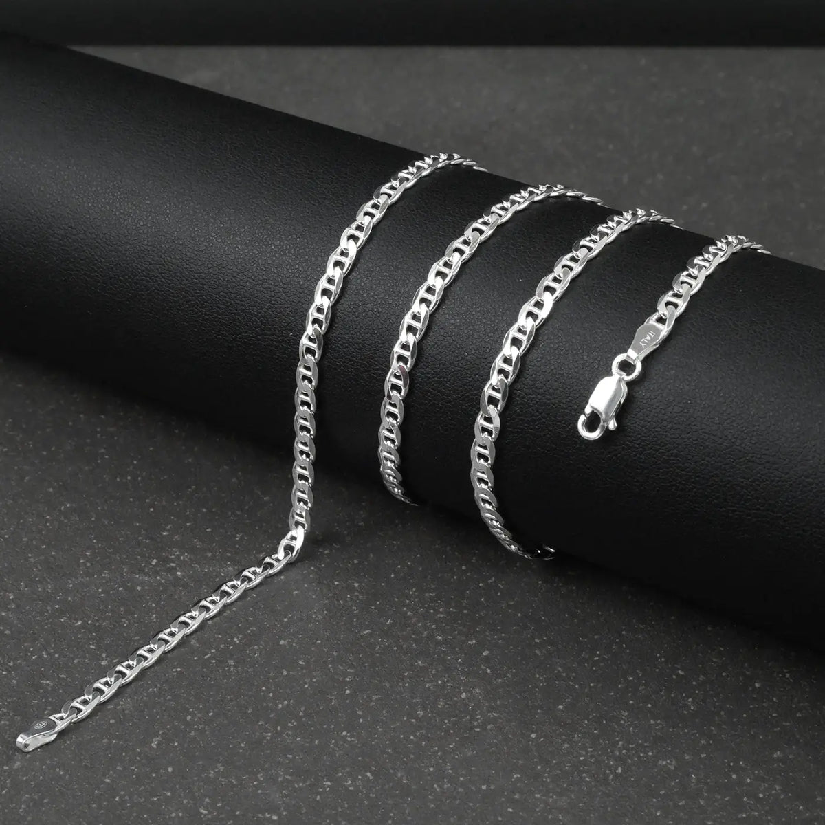 Silver marina chain on a dark surface