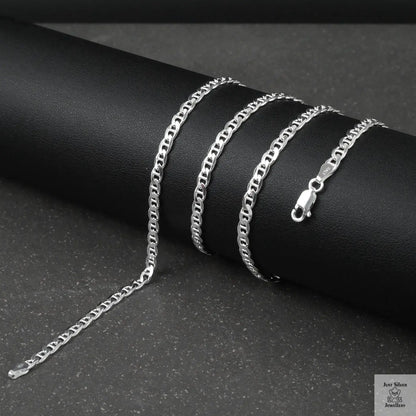 Silver marina chain on a dark surface