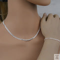 Silver marina necklace and bracelet on a mannequin