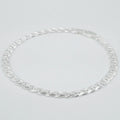 Silver marina link chain necklace on a light grey background