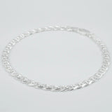 Silver marina link chain necklace on a light grey background