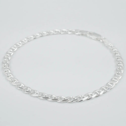Silver marina link chain necklace on a light grey background