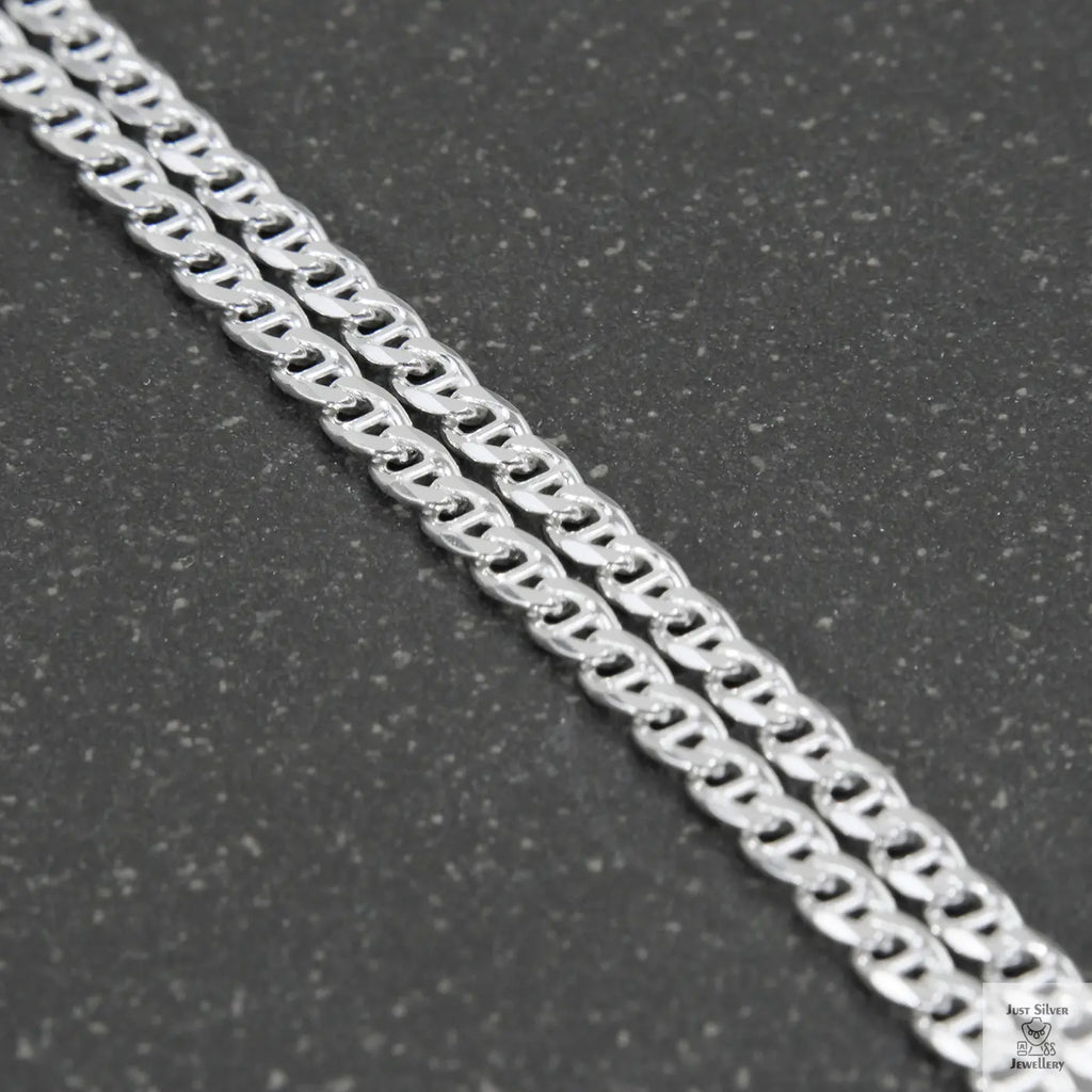 Silver chain on a light gray background