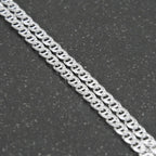 Silver chain on a light gray background