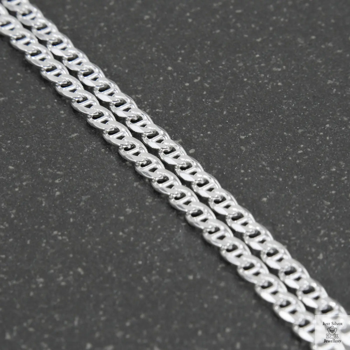 Silver chain on a light gray background