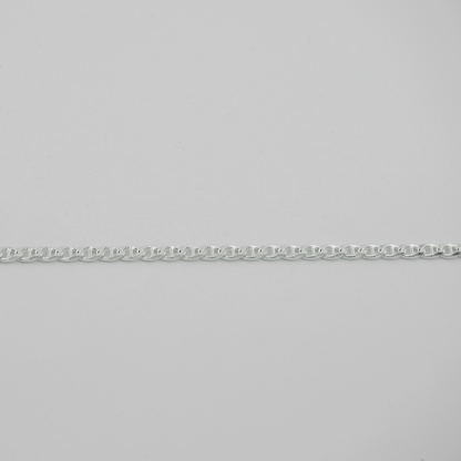 Silver chain on a light gray background