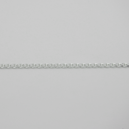 Silver chain bracelet on a light gray background