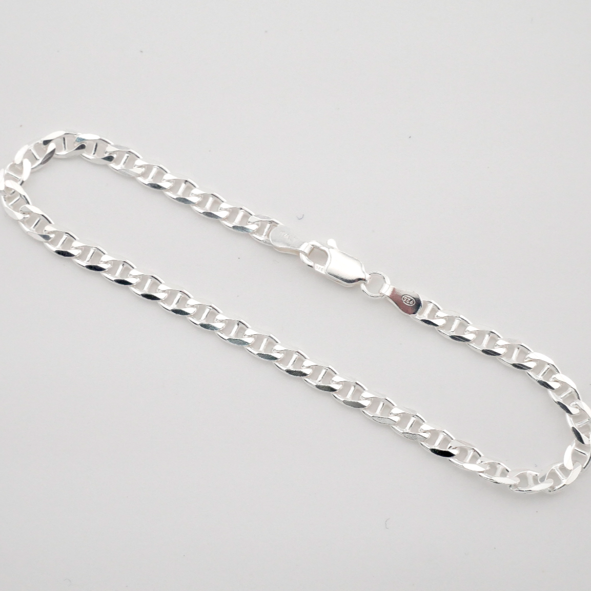Silver chain on a light gray background