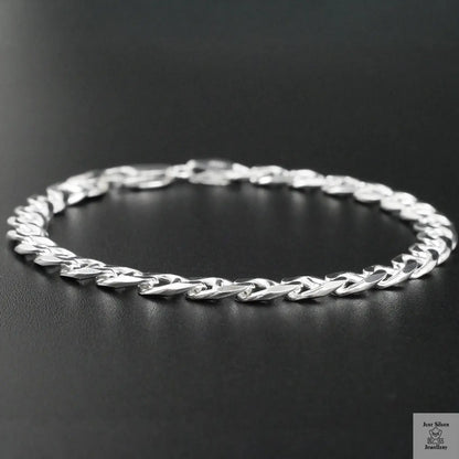 Silver chain bracelet on a black background
