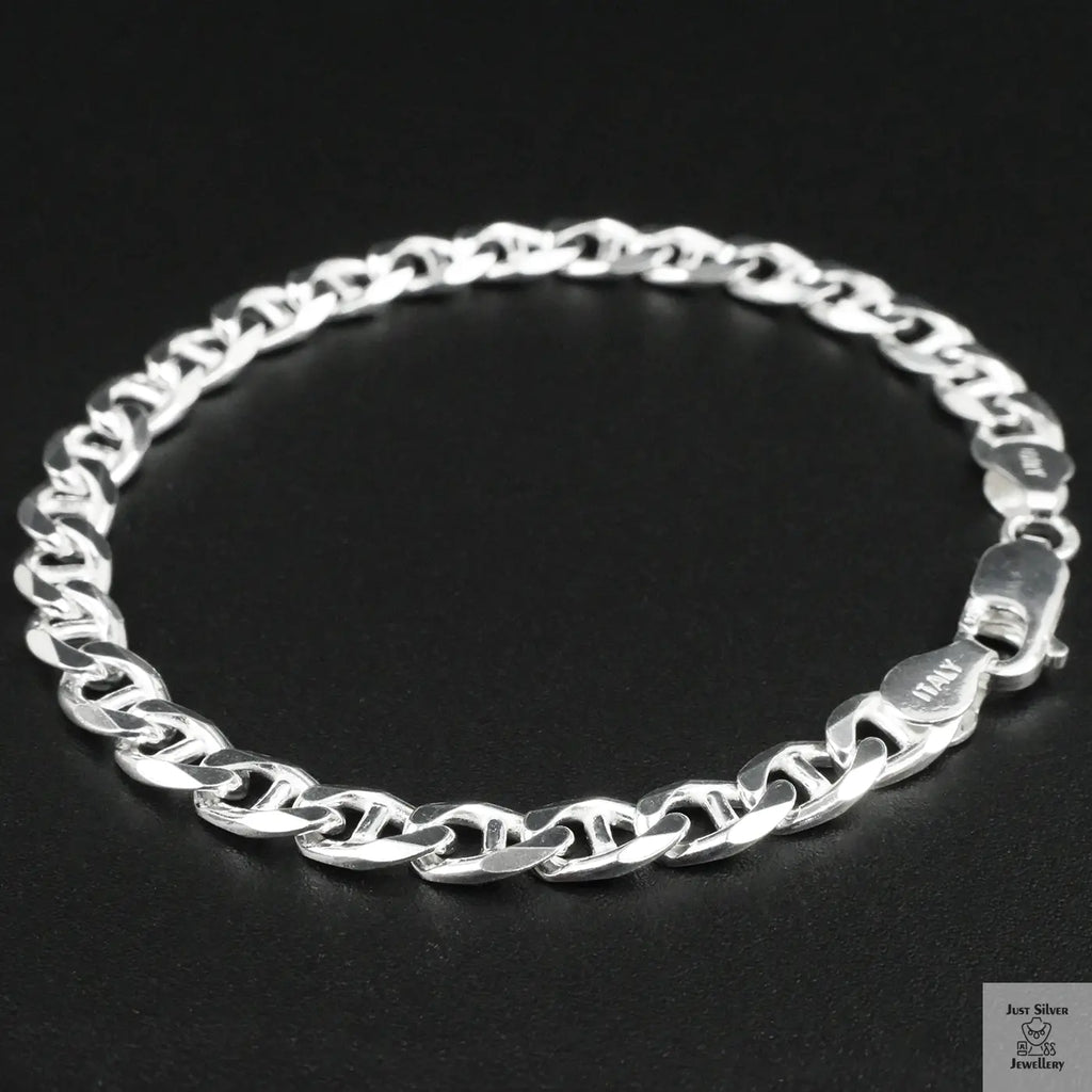 Silver chain bracelet on a black background