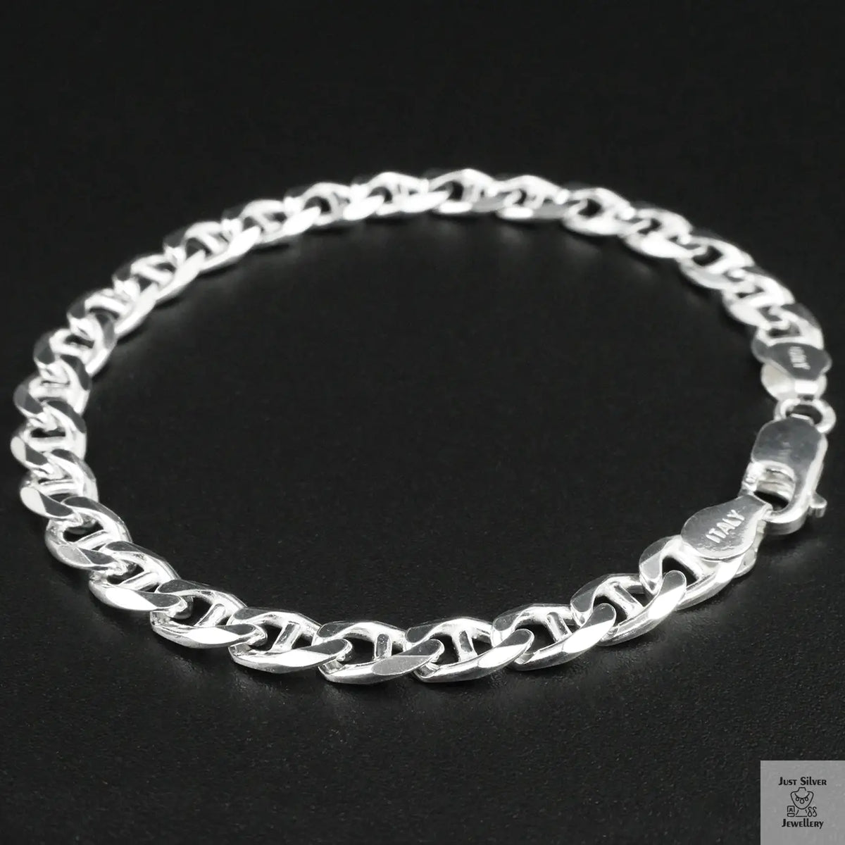 Silver chain bracelet on a black background