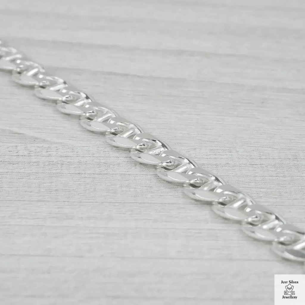 Silver chain on a light grey background