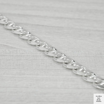 Silver chain on a light grey background