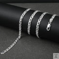 Silver marina chain on a black surface