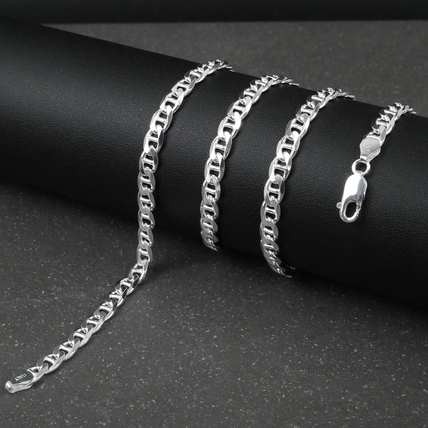 Silver marina chain on a black surface