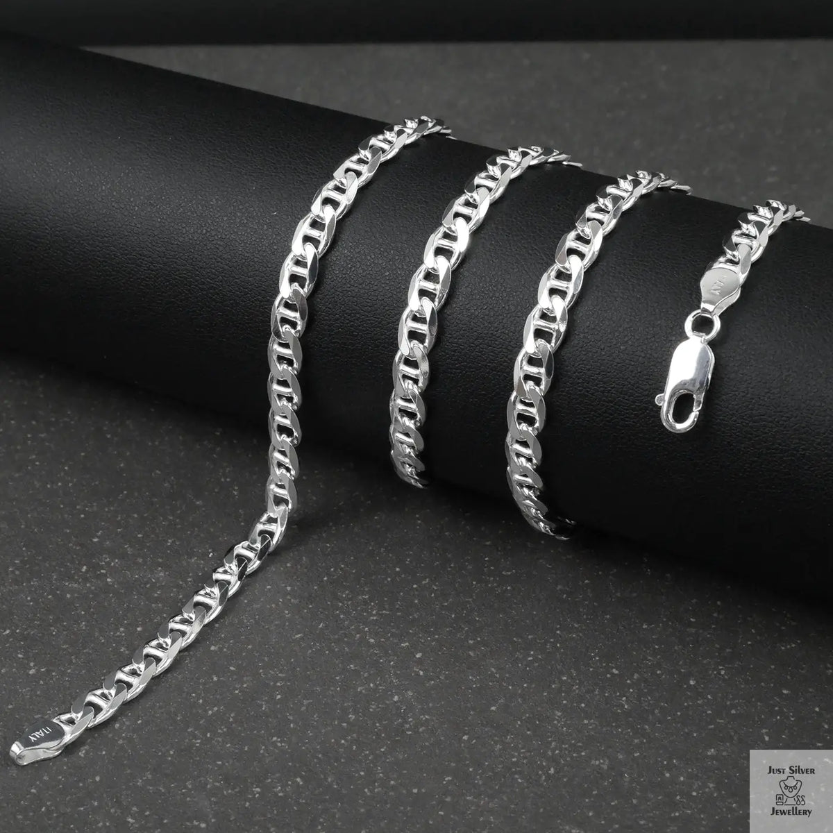 Silver marina chain on a black surface