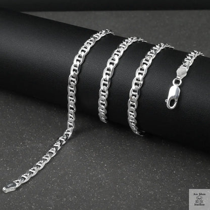 Silver marina chain on a black surface