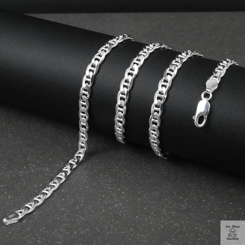 Silver marina chain on a black surface