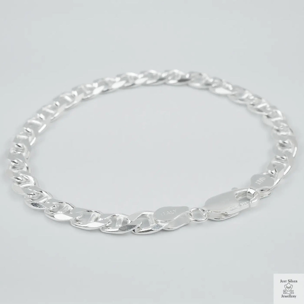 Silver chain bracelet on a light grey background