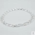 Silver chain bracelet on a light grey background