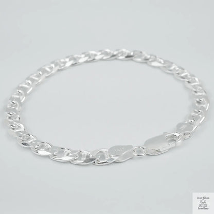 Silver chain bracelet on a light grey background