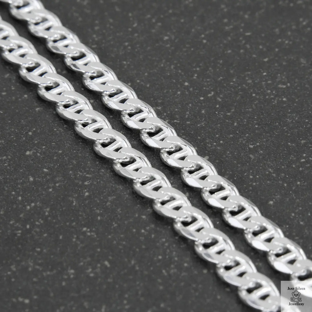Silver chain on a light gray background