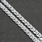 Silver chain on a light gray background