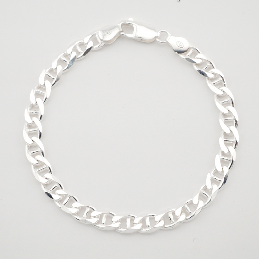 Silver chain bracelet on a light gray background