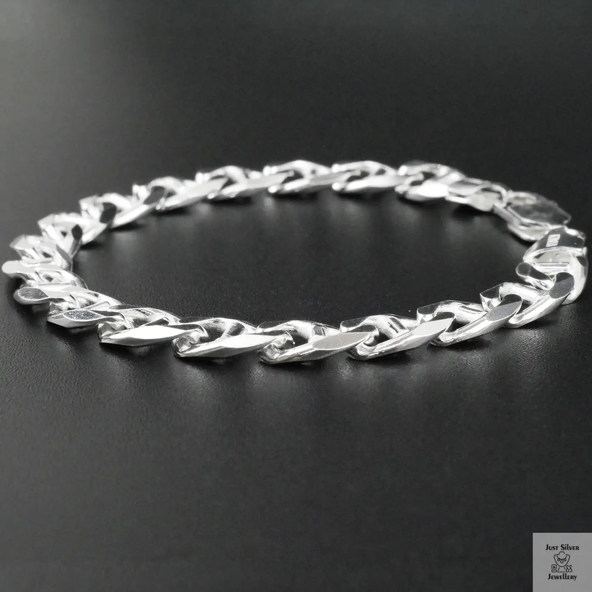 Silver bracelet on a black background