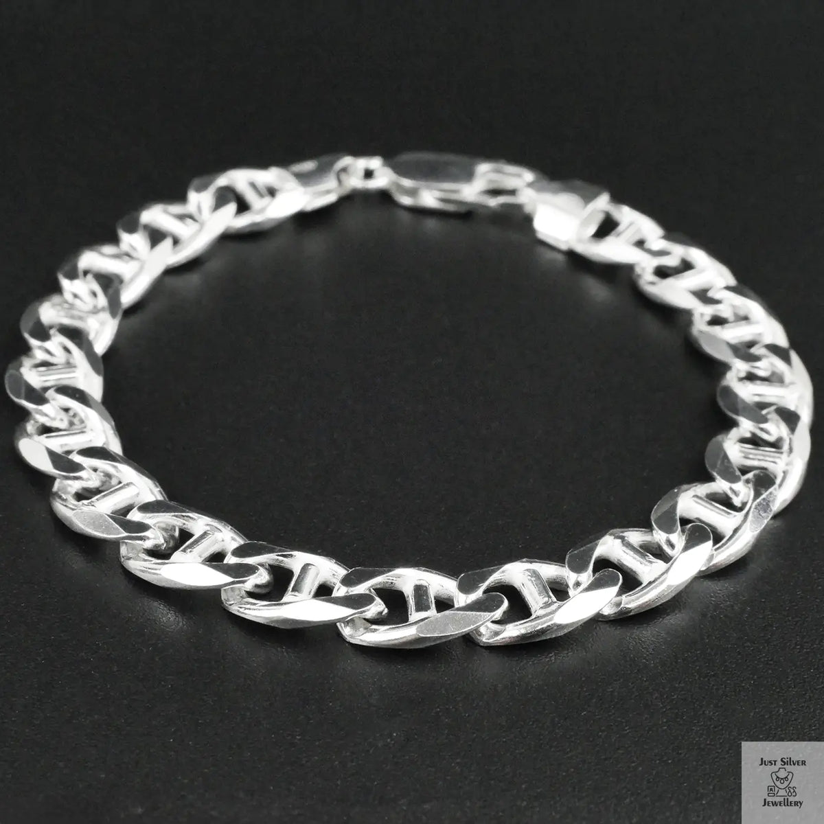 Silver bracelet on a black background
