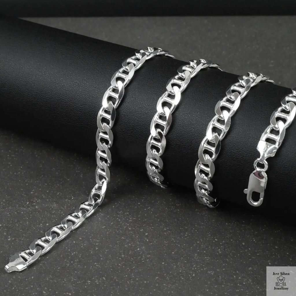 Silver marina chain on a dark surface