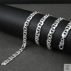 Silver marina chain on a dark surface