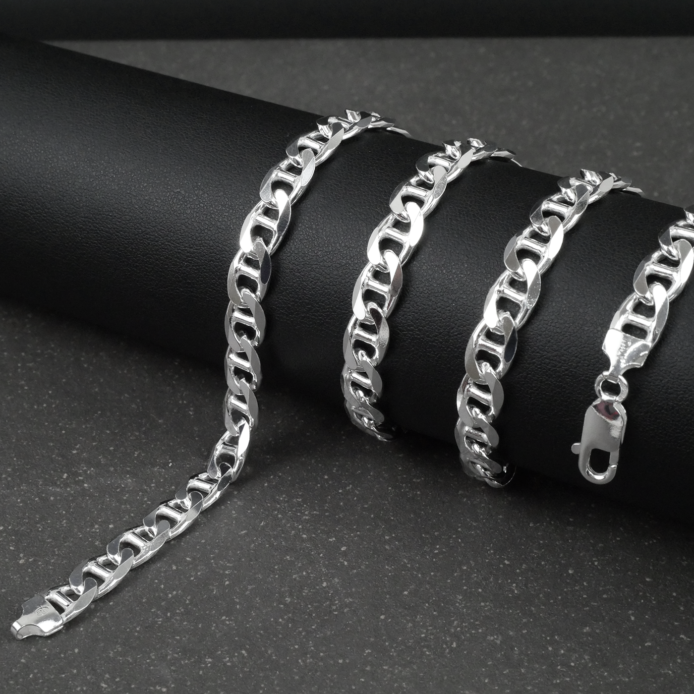 Silver marina chain on a dark surface