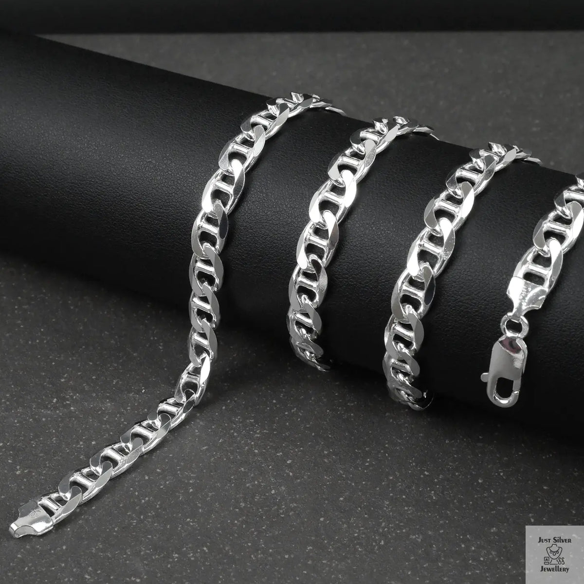 Silver marina chain on a dark surface