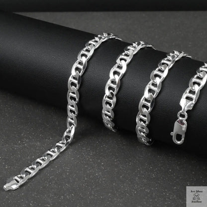 Silver marina chain on a dark surface