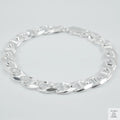 Silver chain bracelet on a light grey background