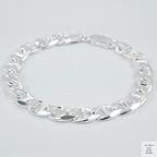 Silver chain bracelet on a light grey background
