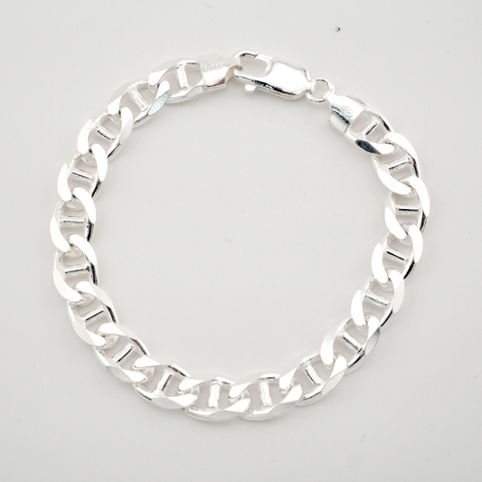 Silver chain bracelet on a light gray background