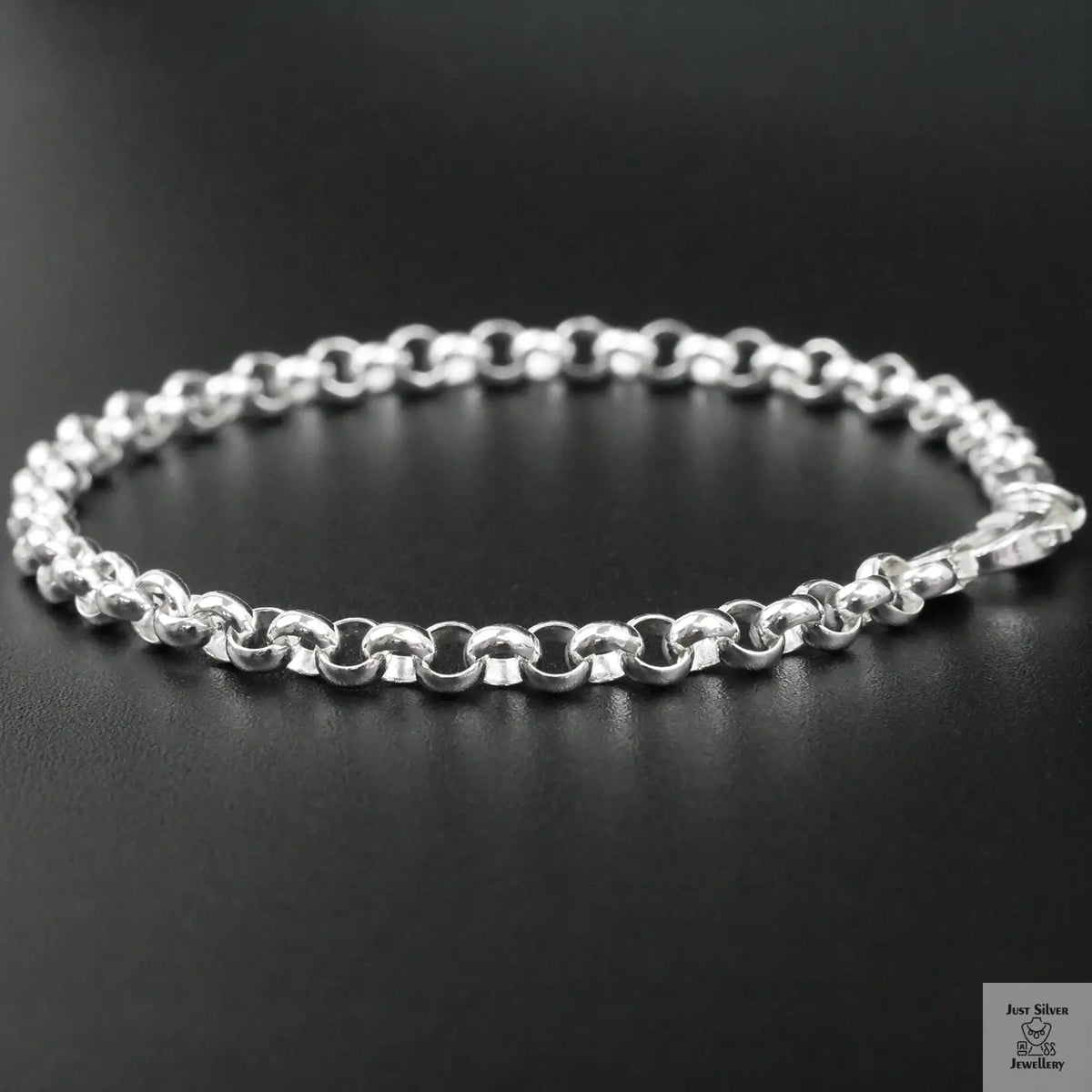 Silver bracelet on a black background