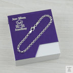Silver bracelet on a purple card with 'Just Silver Jewellery' branding.