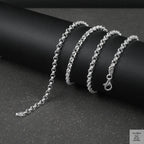 Silver Belcher/Rolo chain bracelet on a dark surface