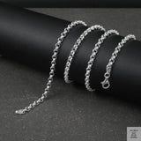 Silver Belcher/Rolo chain bracelet on a dark surface