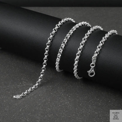 Silver rolo/belcher chain bracelet on a dark surface