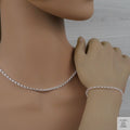 Silver Belcher/Rolo necklace and bracelet on a mannequin with a neutral background