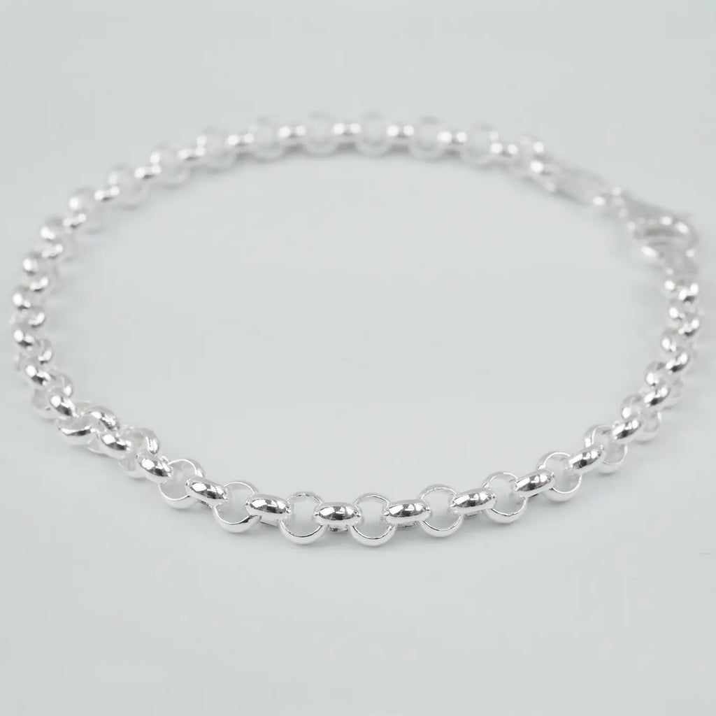 Silver bracelet on a light grey background