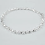 Silver bracelet on a light grey background