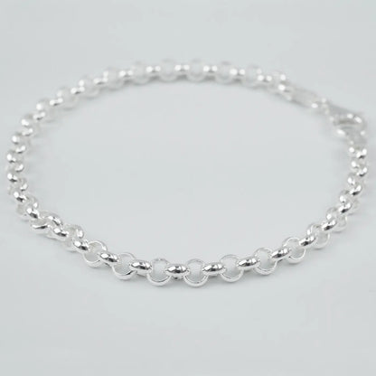 Silver bracelet on a light grey background