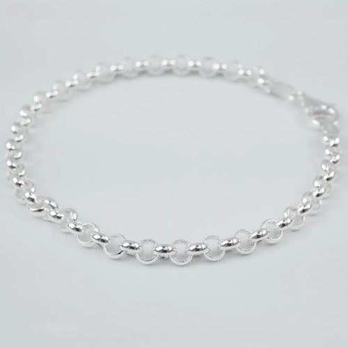 Silver bracelet on a light grey background